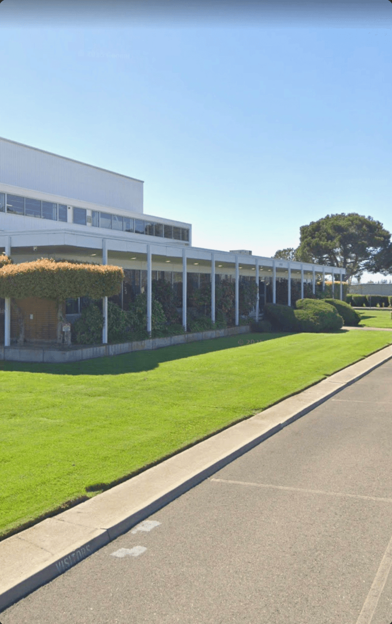 Well-maintained commercial property with manicured lawn and landscaping